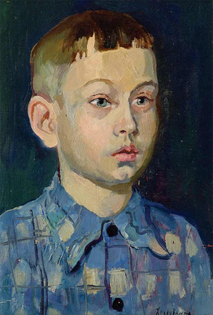 Boy in a blue shirt.